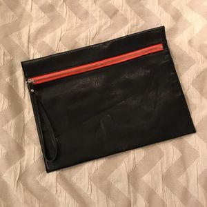 Black clutch with neon pink detail